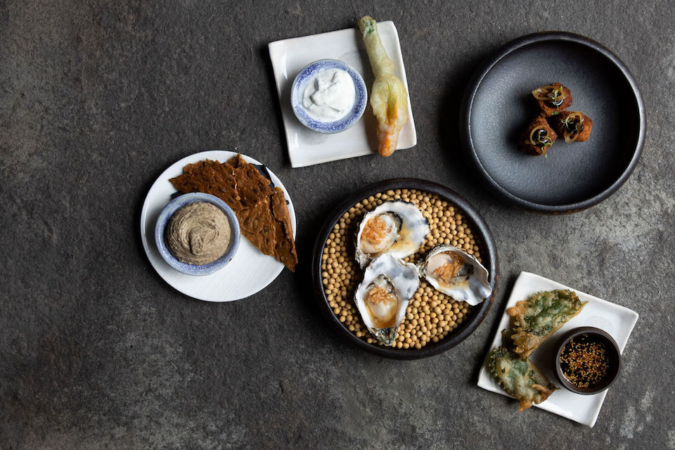 Snacks - lamb bon bon, oyster with ponzu, maple pea hummus, courgette flower, beef and shiso