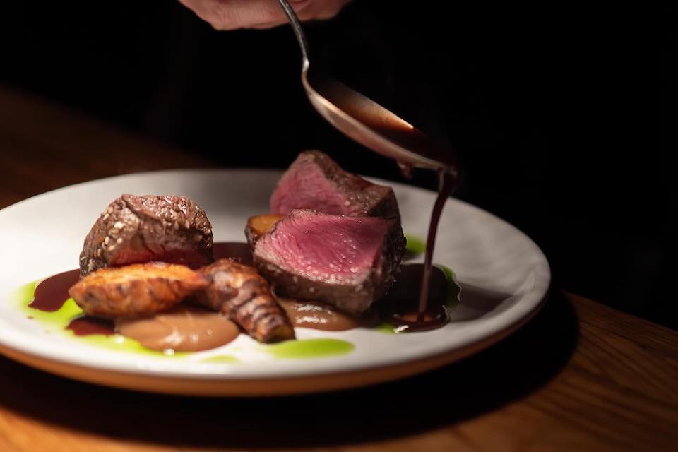 Fish & Forest York plating up a dish