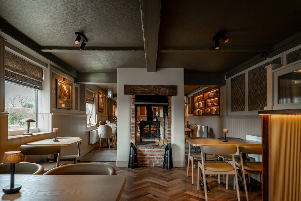 Drovers Arms Skipwith pub seating area interior with fireplace