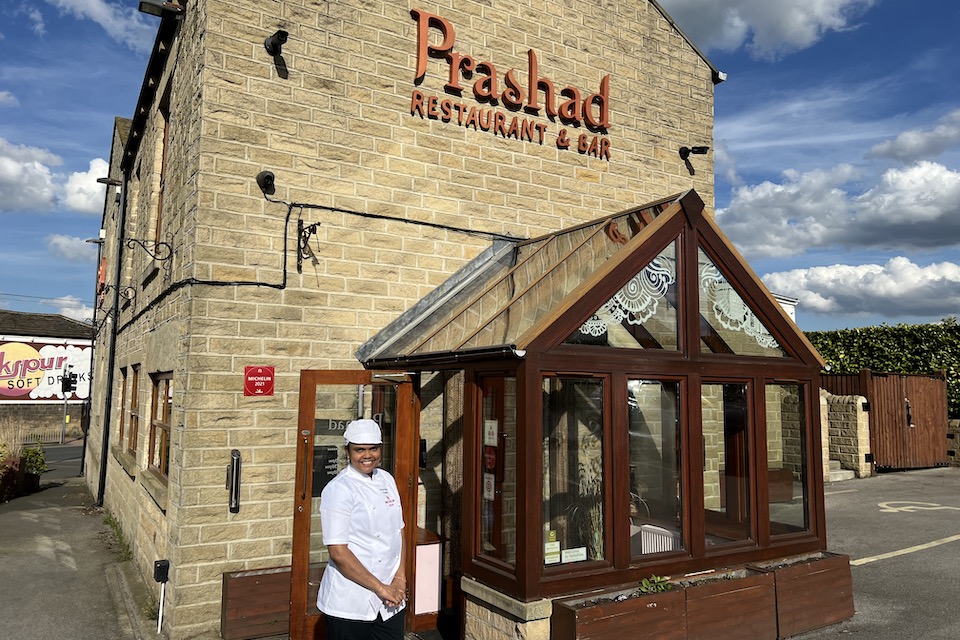 Prashad reviews Minal Patel head chef outside restaurant