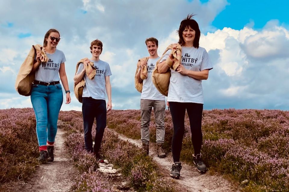 distillery staff walking through moors